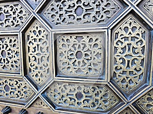 close up details of a traditional Moroccan copper and metal door at the Mohammed V mausoleum in Rabat Morocco