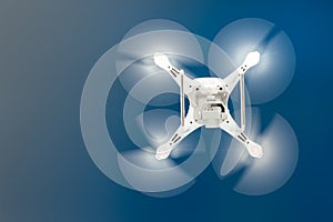 Close up details of uav drone copter flying in clear blue sky