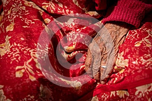 Close up details of the wrinkle hand of a elder nepalese woman