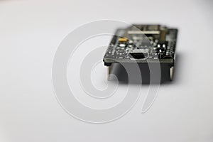 Close up of development board which is used in making IOT projects and other mini electronic projects in white background