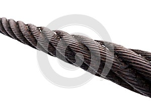 Close-up of diagonal thick rusty metal rope on white background.