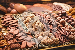 Close up. Different types of cookies in chocolate on the counter at a Spanish bazaar