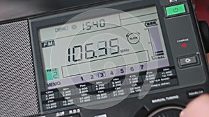 Close-up Digital LCD Scale of Modern Radio with Scanning FM Frequency