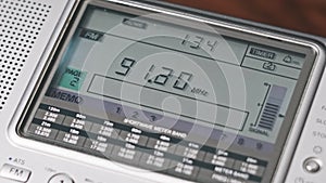 Close-up Digital LCD Scale of Modern Radio with Scanning FM Frequency