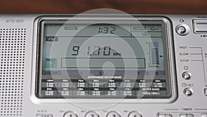 Close-up Digital LCD Scale of Modern Radio with Scanning FM Frequency