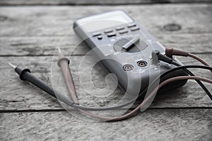 Close-up of digital multimeter on wooden background, Worker used electronic tools for checked circuit