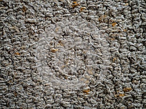 Close up of a dirty grey carpet