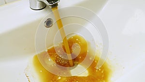 Close up dirty water flowing in sink