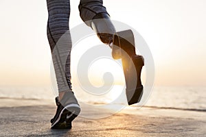 Close up of disabled athlete woman with prosthetic leg