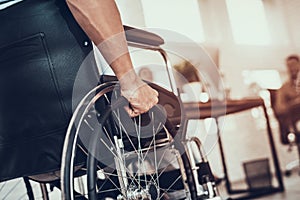 Close up. Disabled Man on Wheelchair in Office.