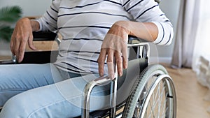 Close up disabled older woman sitting in wheelchair
