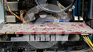 Close-up of a disassembled dusty computer, camera zooming in