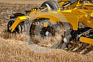 close up of a disc harrow on a field background