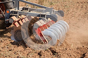 Close up of a disc harrow system, cultivate the soil