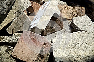 Close up  of discarded cement bricks and pavers