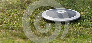 Close up of discuses on grass