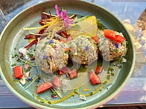 Close up of a dish of Canederli or Knodel, a typical pasta or dumplings for Alps