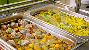 Close-up. display showcase with freshly prepared meals in self-service cafeteria or buffet restaurant. health food
