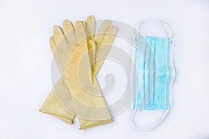 Close-up of disposable surgical masks and rubber gloves