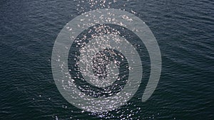 Close up of disturbed blue ocean water surface. Slow motion