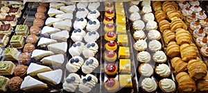 Close-up of a diverse assortment of baked goods and pastries in a commercial display