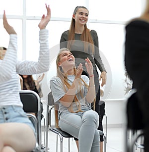 Close up. diverse young participants of the workshop, applauded in unison