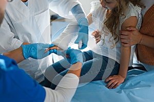 Close-up of doctor giving gypsum to little girl.