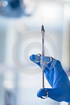 Close up of doctor holding syringe with dental anesthetic. photo