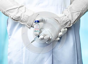 Close up doctor holding syringe to injection to the patient in medical. Covid-19 or coronavirus vaccine. virus removal and