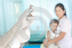 Close up doctor holding syringe to injection to the patient in medical. Covid-19 or coronavirus vaccine. virus removal and