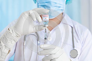 Close up doctor holding syringe to injection to the patient in medical. Covid-19 or coronavirus vaccine. virus removal and