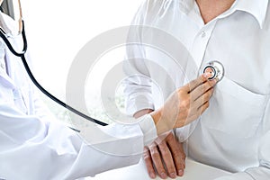 Close up of doctor listening to patient heartbeat with stethoscope on hospital, Physical examination, Medical and health care