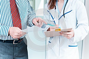 Close-up of doctor and patient hands