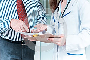 Close-up of doctor and patient hands