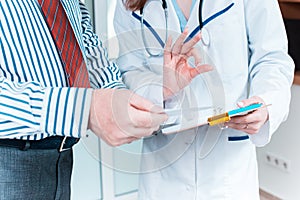 Close-up of doctor and patient hands