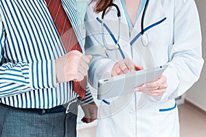 Close-up of doctor and patient hands