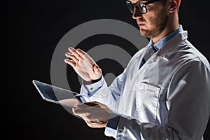 Close up of doctor or scientist with tablet pc