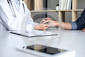 Close up of doctor touching patient hand for encouragement and empathy on the hospital, cheering and support patient, Bad news,