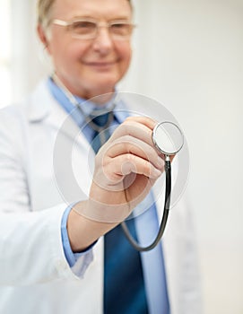 Close up of doctor in white coat with stethoscope
