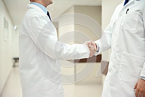 Close up of doctors making handshake