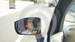 SLOW MOTION: Angry Caucasian man throwing a temper tantrum while driving to work