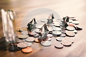 Close up dollar boat and coins