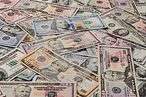 Close up dollar texture, dollars in denominations of five, ten, twenty, fifty, one hundred