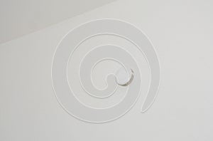 A close-up on a domestic, residential smoke detector, smoke sensor as a part of a fire alarm system in a house