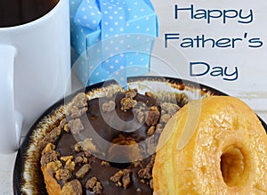 Close up of donuts, or doughnuts, on a brown ceramic plate. Good image for donuts and dads for father`s day in June. photo