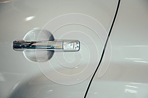 Close up door car whit handle.