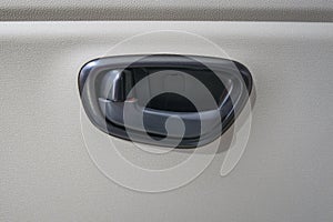 close-up door handle with car lock inside
