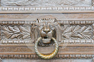 Close-up door handle lion with ring in mouth, classic knocker