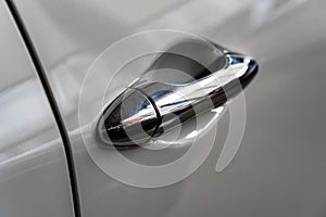 Modern grey car door handle close