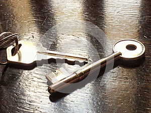 Close up door key with wood table background